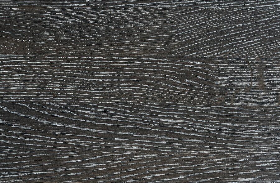 A sample of oak in the dark grey, white brushed finish.